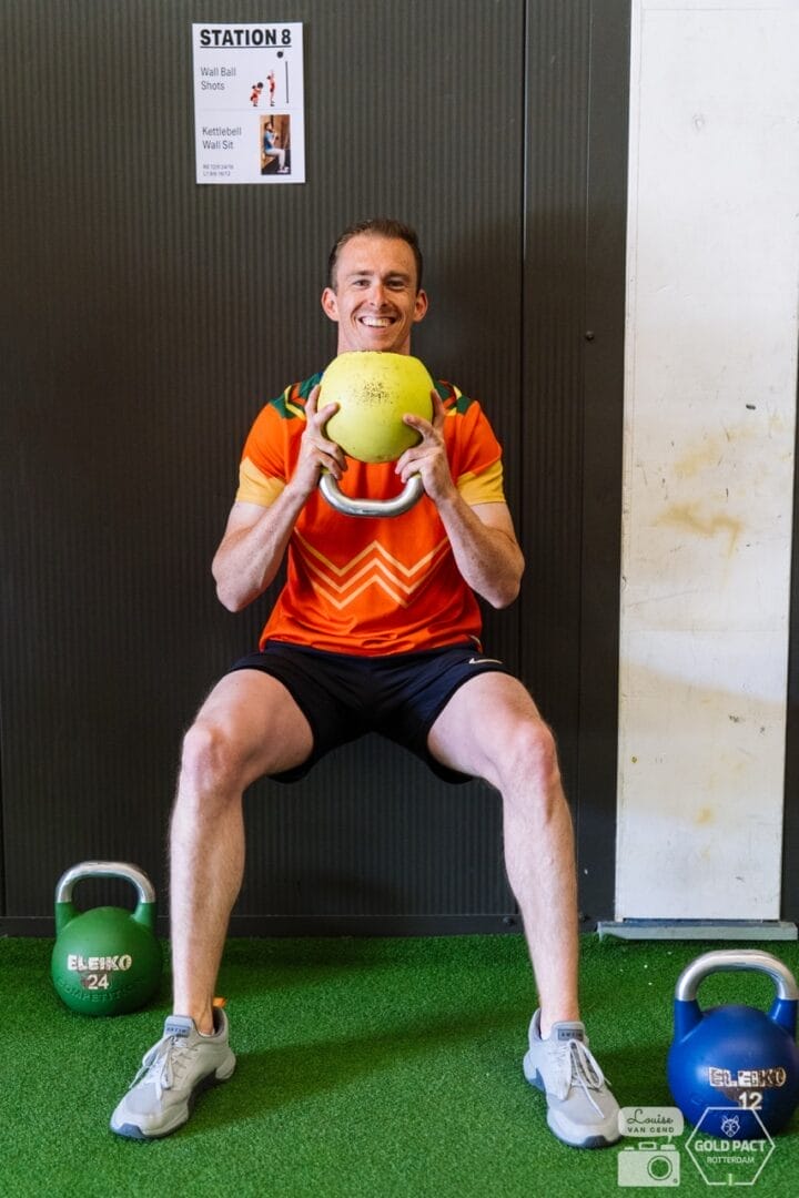 Athlete performing a squat during Functional Strength training
